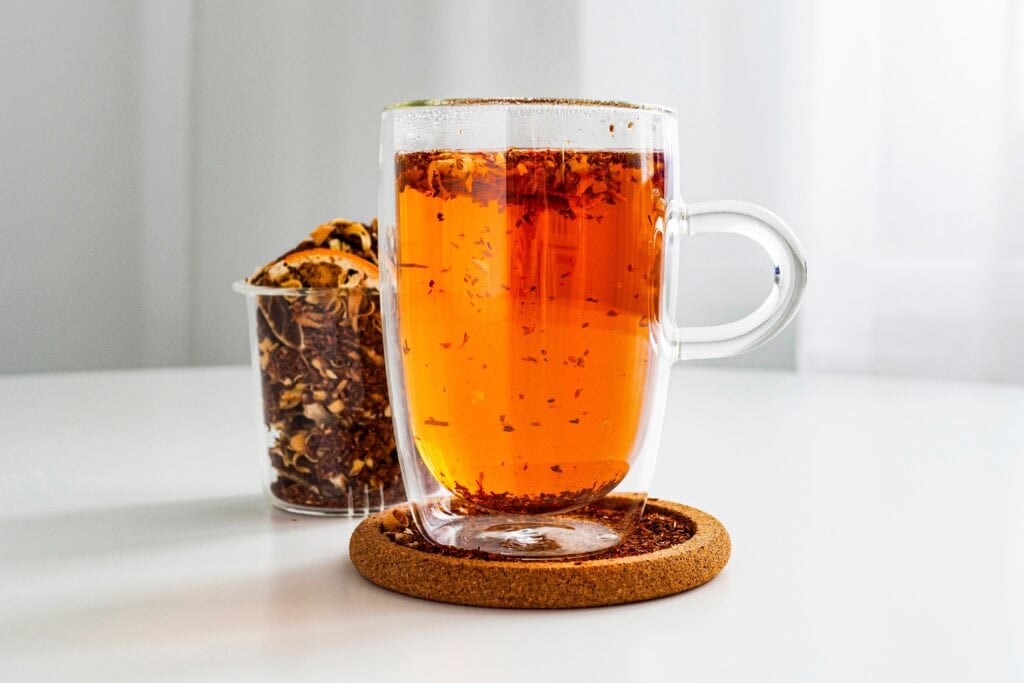 Rooibos Tea In A Transparent Thermos Mug On The Table