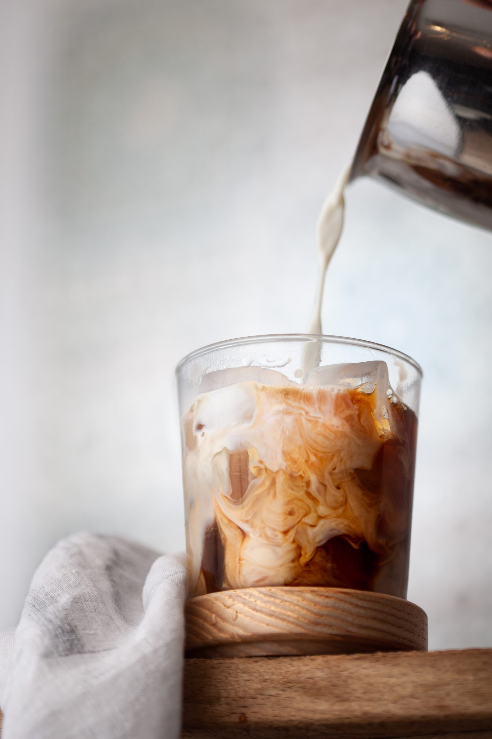 coffee with cream pouring in