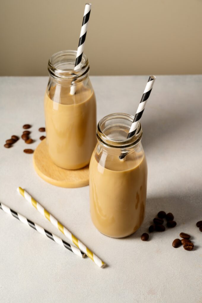 Iced Refreshing Coffee Or Latte. Chocolate Drinks In Glass Bottles