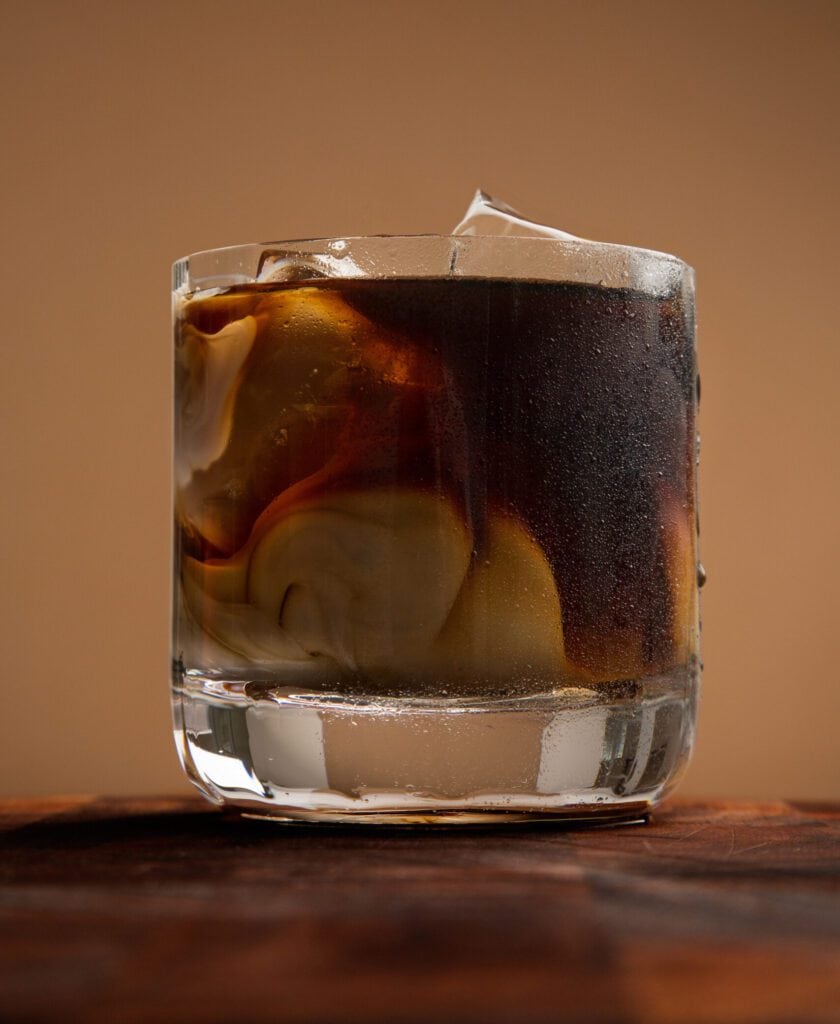 Cream and cold brewed coffee over ice