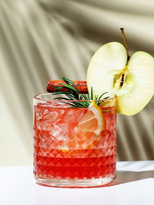 Red zero proof cocktail with a twist of apple