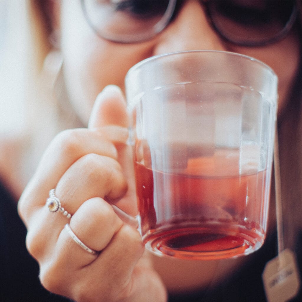 Hot tea in a mug enhanced by natural flavor essence