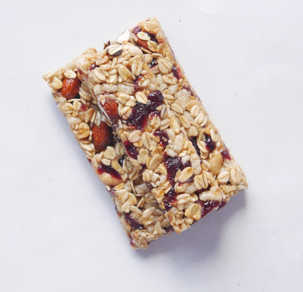 Protein bar improved by flavor enhancement